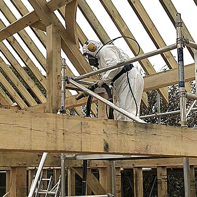 Wood treatment taking place to remove saw marks